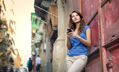 Young woman holding a smartphone in her hands