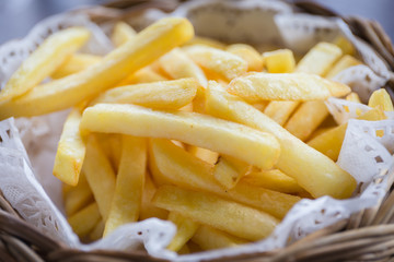 French fries in the wood basket with sauce
