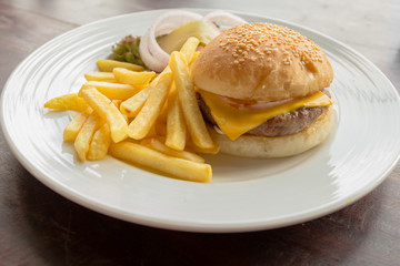 Cheese burger with french fries on the table