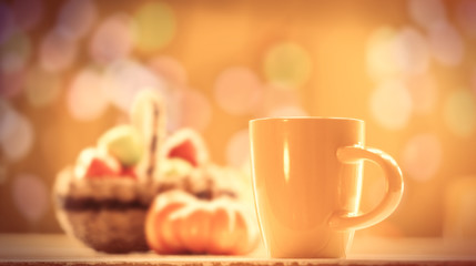 Pumpkin, basket with apples and cup