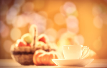 Pumpkin, basket with apples and cup