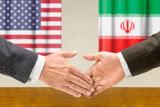 Vertreter der USA und des Irans reichen sich die Hand