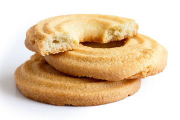 Three butter ring biscuits isolated on white in perspective. One