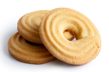 Three butter ring biscuits isolated on white in perspective. - obrazy, fototapety, plakaty