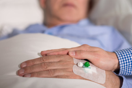 Elder person's hand with venflon