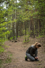 Fototapeta premium Girl training in the forest
