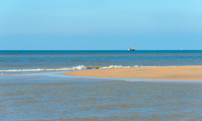 Trawler fishing at sea in autumn