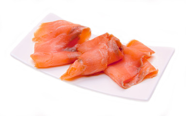Smoked salmon on small tray on white background