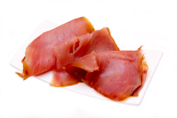 Smoked tuna on a small tray on white background