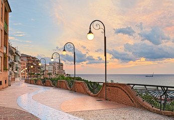 seafront at dawn in Ortona, Abruzzo, Italy - beautiful terrace with street lamp on the Adriatic sea 
 - obrazy, fototapety, plakaty