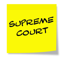 Supreme Court written on a yellow sticky note