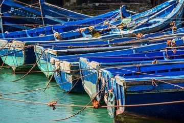blue boats in the harbour of essaouira