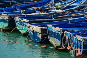 Fototapeta na wymiar blue boats in the harbour of essaouira