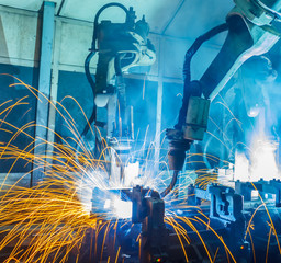 Welding robots movement in a car factory