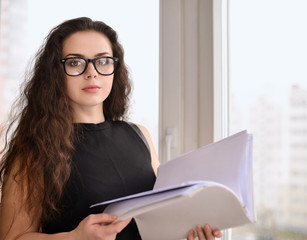 Portrait of a businesswoman holding papers
