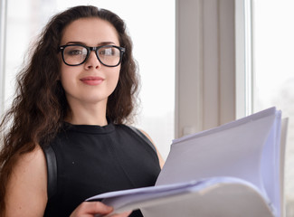 Portrait of a businesswoman holding papers