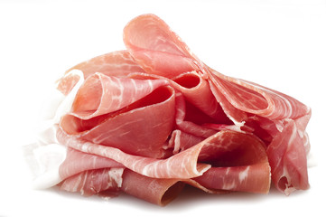 Italian prosciutto crudo ,raw ham leg sliced on white