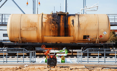 Railroad train of black tanker cars 