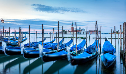 Fototapeta premium Gondolas in Venice at sunrise