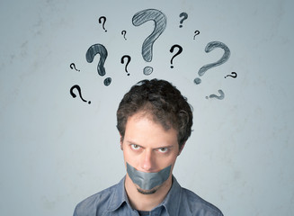 Young man with glued mouth and question mark symbols