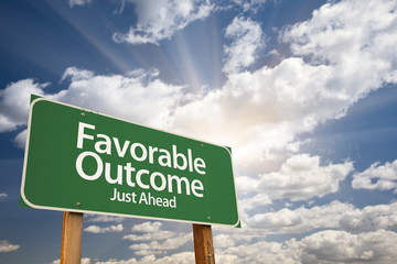 Favorable Outcome Green Road Sign Over Clouds