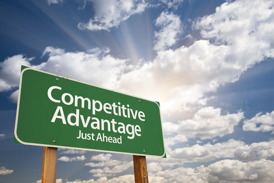 Competitive Advantage Green Road Sign Over Clouds