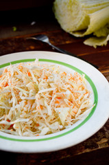pickled cabbage and carrots in a white plate