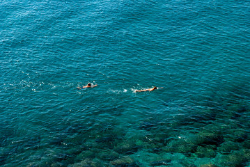 Obraz premium Swimmers offshore