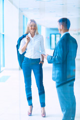 Smiling successful business team standing in office