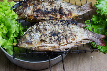Salt crusted grilled nile tilapia fish