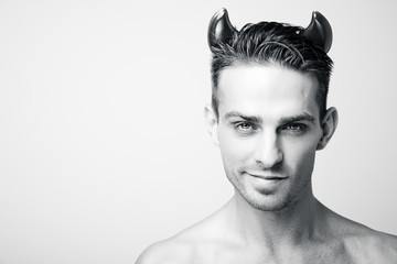 A man in a devil costume on Halloween