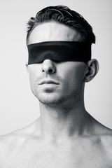 Portrait of a man with a blindfold