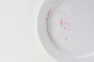 empty plate on white table after blackberry pie