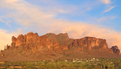 Dramatic rock formation in Arizona with blue skies as sun is starting to set