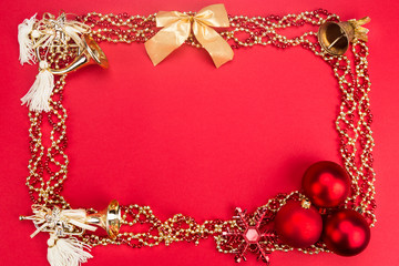 Beautiful ornaments framed Christmas decoration in red background