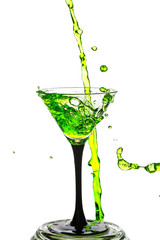 Cocktail glass with splash isolated on white background.