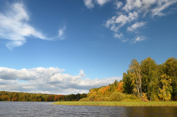 Landscape colorful autumn forest lake river sky clouds