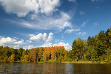 Landscape colorful autumn forest lake river sky clouds
