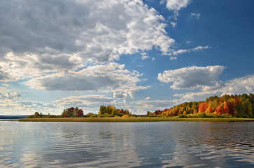 Landscape colorful autumn forest lake river sky clouds
