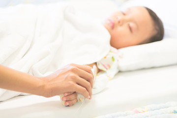 Obraz na płótnie Canvas Young boy sleep and sickness stay in hospital