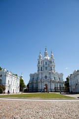 Fototapeta na wymiar Smolny Cathedral, St. Petersburg, Russia. Churches and temples. Orthodox Cathedral. Historical place. Bell, an ancient White Church building on the banks of the river Neva.
