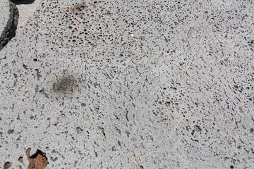 stone wall and gray cement floor