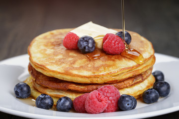 Pancakes with raspberry, blueberry and maple syrup