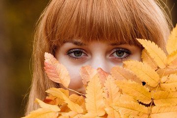 Beautiful young woman - colorful autumn portrait