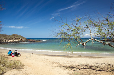 Couple that sunbathing and Kapukahefu Beach, Molokai, Hawaii