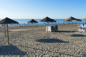 Obraz premium Sunset on the beach and umbrella