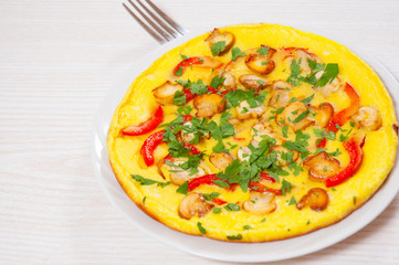 omelet with mushrooms, and vegetables