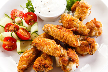 Grilled chicken wings and vegetables 