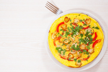 omelet with mushrooms, and vegetables