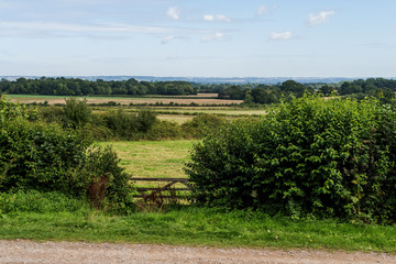 Fences, fields and trees around Sissinghurst / View of the countryside across the fields around...